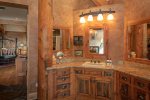 The elegant rustic decor extends to the master ensuite.